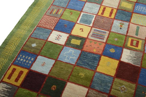 Backside of handmade New Persian Gabbeh rug showing knot structure and weave density