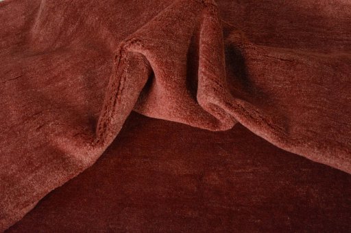 Corner detail of New Persian Gabbeh rug showing border pattern and Wool pile
