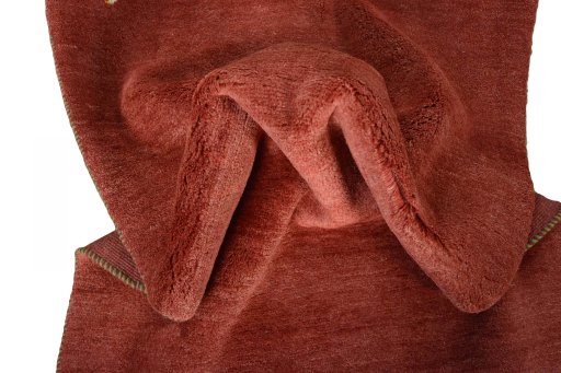 Corner detail of New Persian Gabbeh rug showing border pattern and Wool pile