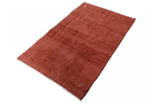 Corner detail of New Persian Gabbeh rug showing border pattern and Wool pile