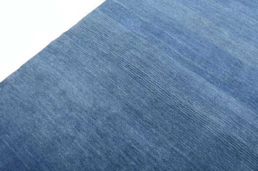 Backside of handmade New Persian Gabbeh rug showing knot structure and weave density