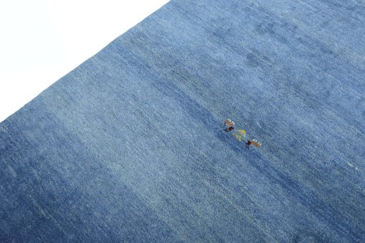 Backside of handmade New Persian Gabbeh rug showing knot structure and weave density