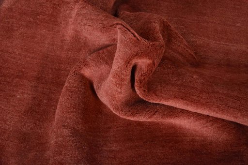 Corner detail of New Persian Gabbeh rug showing border pattern and Wool pile