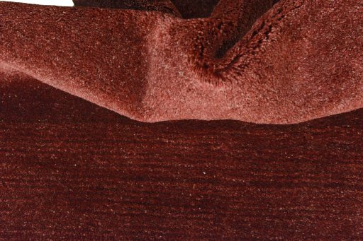 Corner detail of New Persian Gabbeh rug showing border pattern and Wool pile