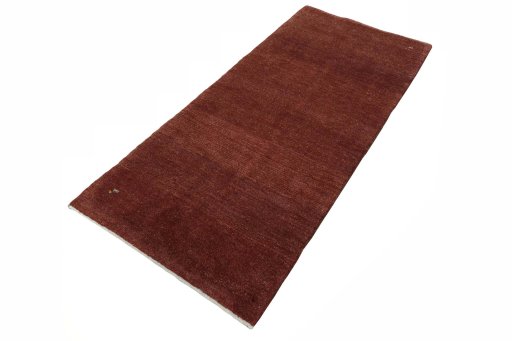 Corner detail of New Persian Gabbeh rug showing border pattern and Wool pile