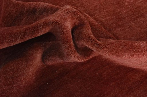 Corner detail of New Persian Gabbeh rug showing border pattern and Wool pile