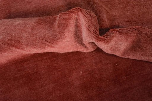 Corner detail of New Persian Gabbeh rug showing border pattern and Wool pile