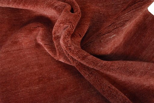 Corner detail of New Persian Gabbeh rug showing border pattern and Wool pile
