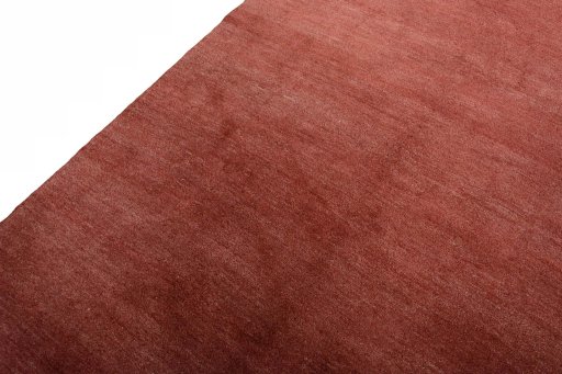 Backside of handmade New Persian Gabbeh rug showing knot structure and weave density