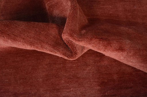 Corner detail of New Persian Gabbeh rug showing border pattern and Wool pile