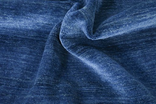 Corner detail of New Persian Gabbeh rug showing border pattern and Wool pile