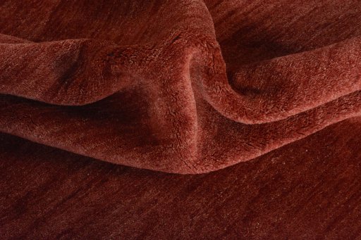 Corner detail of New Persian Gabbeh rug showing border pattern and Wool pile