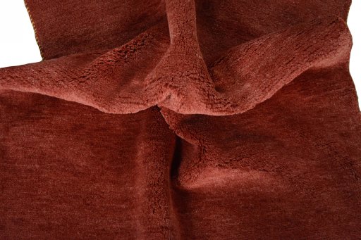 Corner detail of New Persian Gabbeh rug showing border pattern and Wool pile