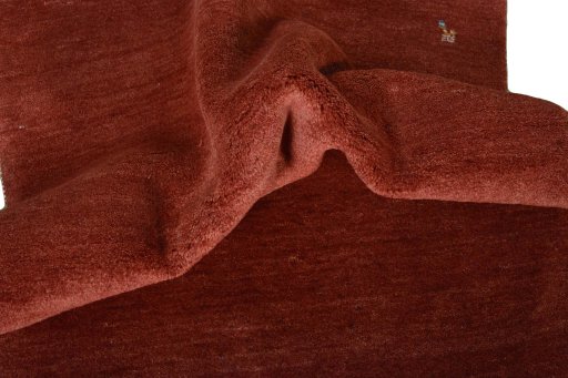 Corner detail of New Persian Gabbeh rug showing border pattern and Wool pile