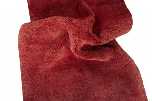 Corner detail of New Persian Gabbeh rug showing border pattern and Wool pile