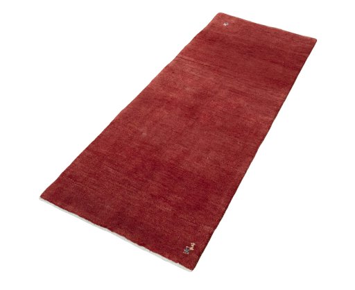 Corner detail of New Persian Gabbeh rug showing border pattern and Wool pile