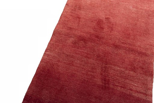 Backside of handmade New Persian Gabbeh rug showing knot structure and weave density