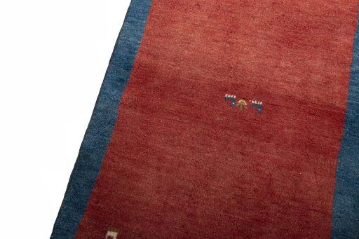 Backside of handmade New Persian Gabbeh rug showing knot structure and weave density