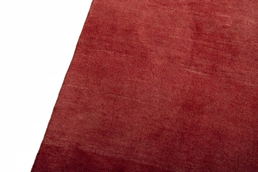 Backside of handmade New Persian Gabbeh rug showing knot structure and weave density