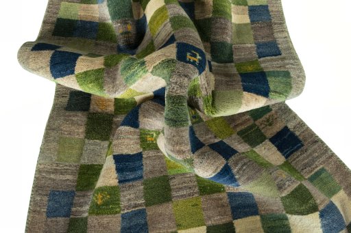Corner detail of New Persian Gabbeh rug showing border pattern and Wool pile