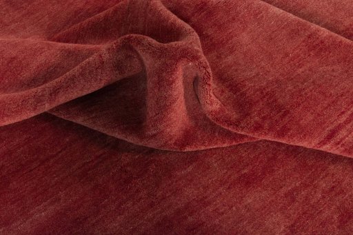 Corner detail of New Persian Gabbeh rug showing border pattern and Wool pile