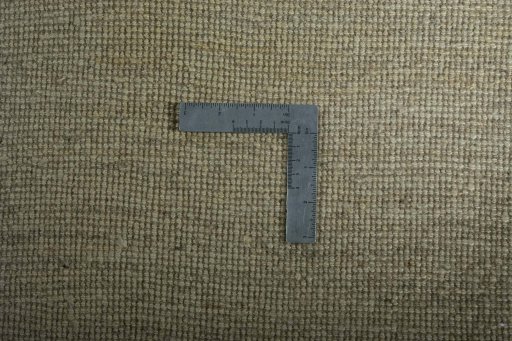 Corner detail of New Persian Gabbeh rug showing border pattern and Wool pile