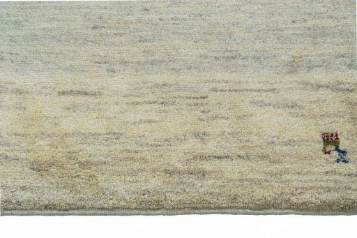 Backside of handmade New Persian Gabbeh rug showing knot structure and weave density