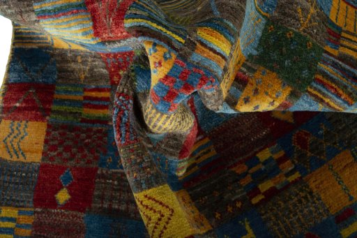 Corner detail of New Persian Gabbeh rug showing border pattern and Wool pile