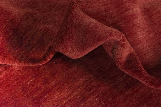 Corner detail of New Persian Gabbeh rug showing border pattern and Wool pile