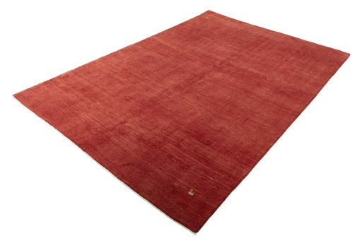 Corner detail of New Persian Gabbeh rug showing border pattern and Wool pile