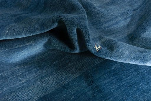 Corner detail of New Persian Gabbeh rug showing border pattern and Wool pile