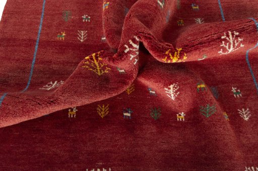 Corner detail of New Persian Gabbeh rug showing border pattern and Wool pile