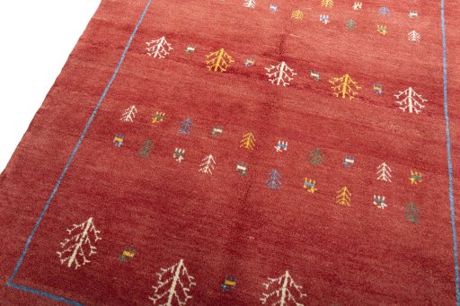 Backside of handmade New Persian Gabbeh rug showing knot structure and weave density