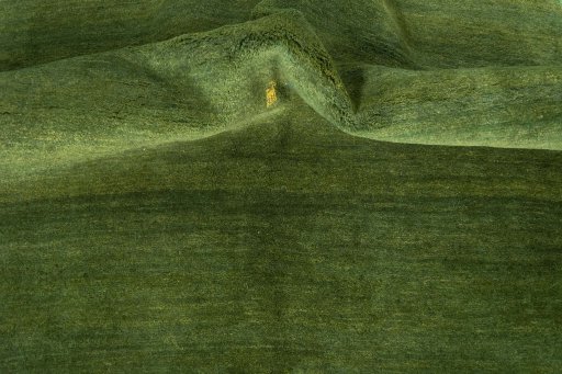 Corner detail of New Persian Gabbeh rug showing border pattern and Wool pile