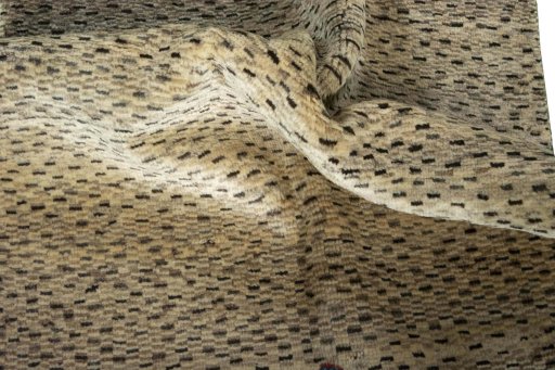 Corner detail of 2000s Persian Gabbeh rug showing border pattern and Wool pile
