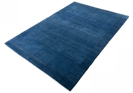 Corner detail of New Persian Gabbeh rug showing border pattern and Wool pile