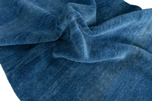 Corner detail of New Persian Gabbeh rug showing border pattern and Wool pile