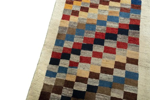 Backside of handmade 2000s Persian Gabbeh rug showing knot structure and weave density