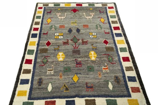 Surface texture of 2000s Persian Gabbeh rug with natural Wool and intricate pattern