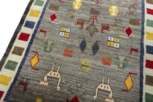 Backside of handmade 2000s Persian Gabbeh rug showing knot structure and weave density