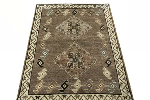 Surface texture of 2000s Persian Gabbeh rug with natural Wool and intricate pattern