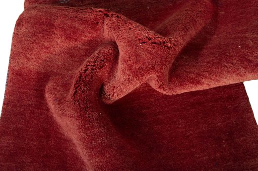 Corner detail of New Persian Gabbeh rug showing border pattern and Wool pile