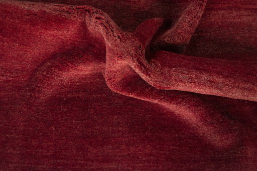 Corner detail of New Persian Gabbeh rug showing border pattern and Wool pile