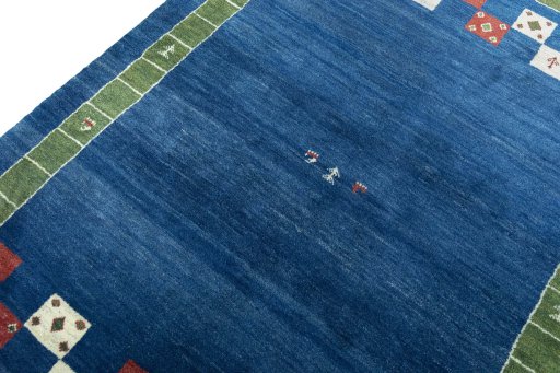 Backside of handmade New Persian Gabbeh rug showing knot structure and weave density