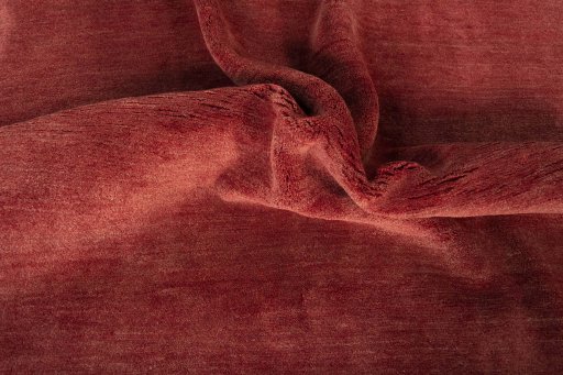 Corner detail of New Persian Gabbeh rug showing border pattern and Wool pile