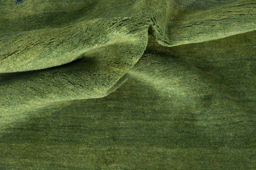 Corner detail of New Persian Gabbeh rug showing border pattern and Wool pile