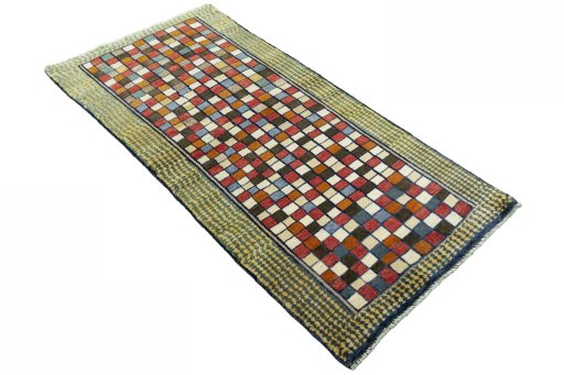 Close-up detail of 2000s Persian Gabbeh rug from Iran / Persia showing Wool weave