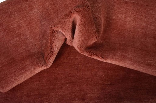 Corner detail of New Persian Gabbeh rug showing border pattern and Wool pile