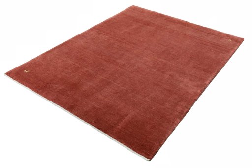 Corner detail of New Persian Gabbeh rug showing border pattern and Wool pile