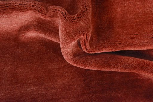 Corner detail of New Persian Gabbeh rug showing border pattern and Wool pile